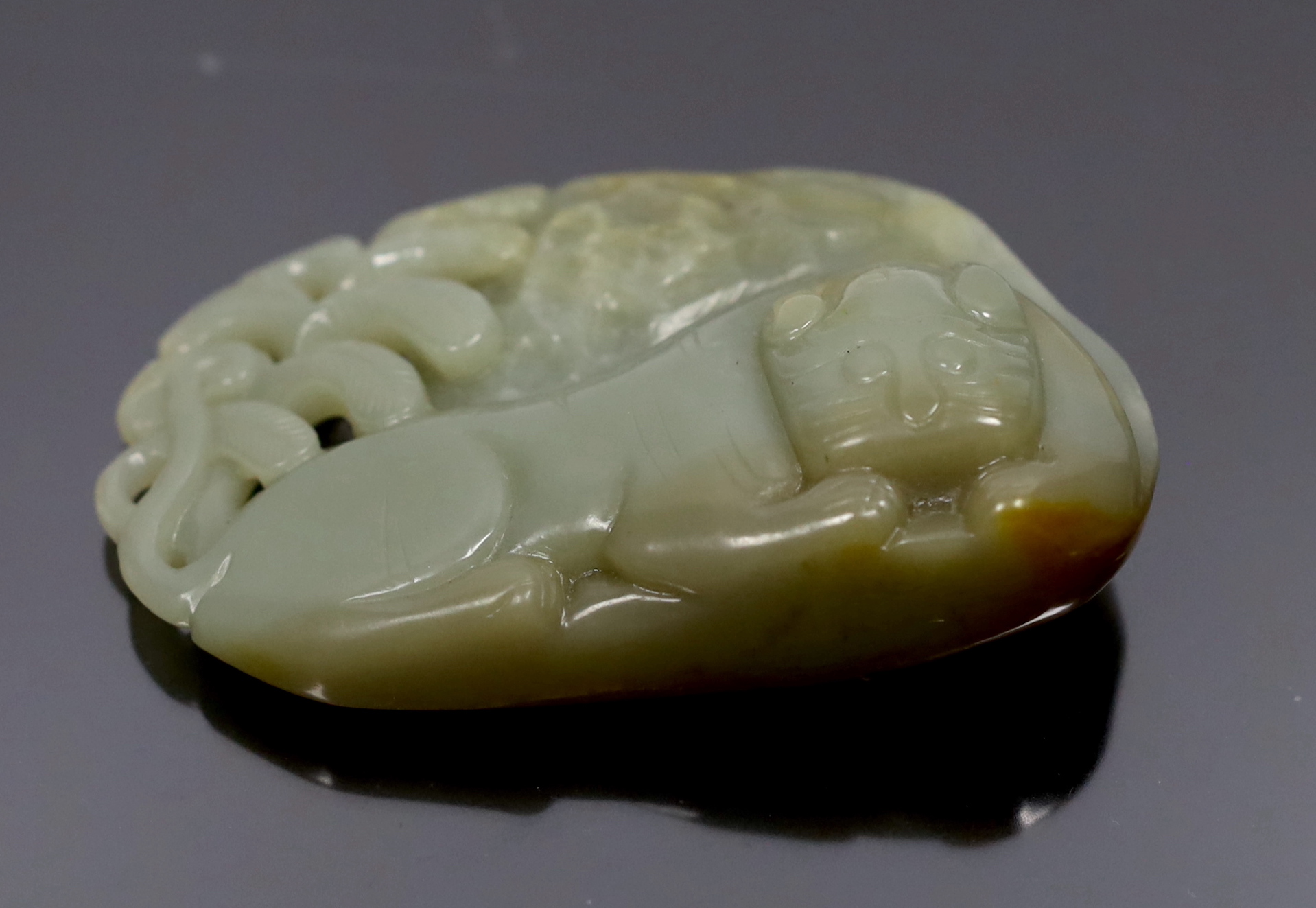 A Chinese jade tiger carving